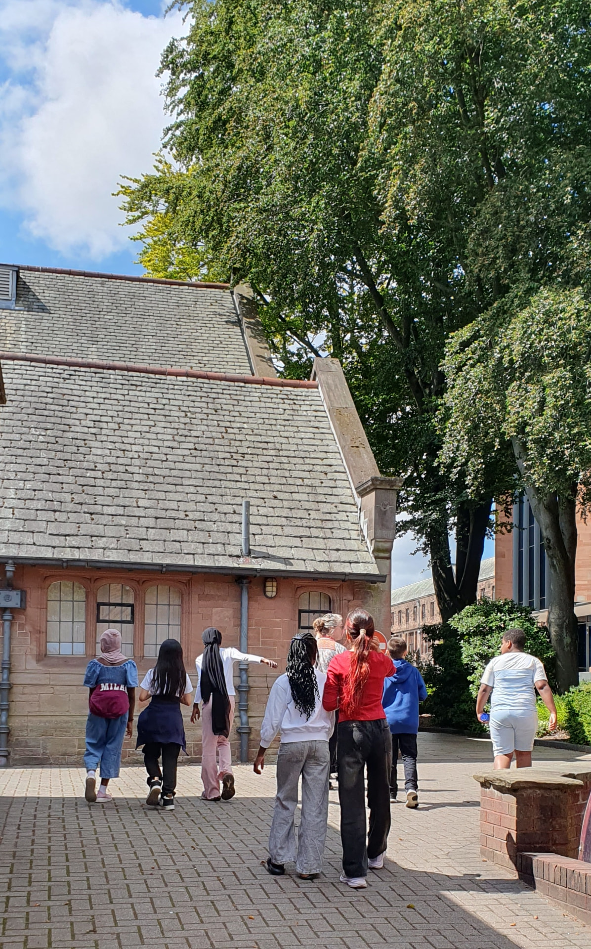 Pupils walking together outdoors on a school visit